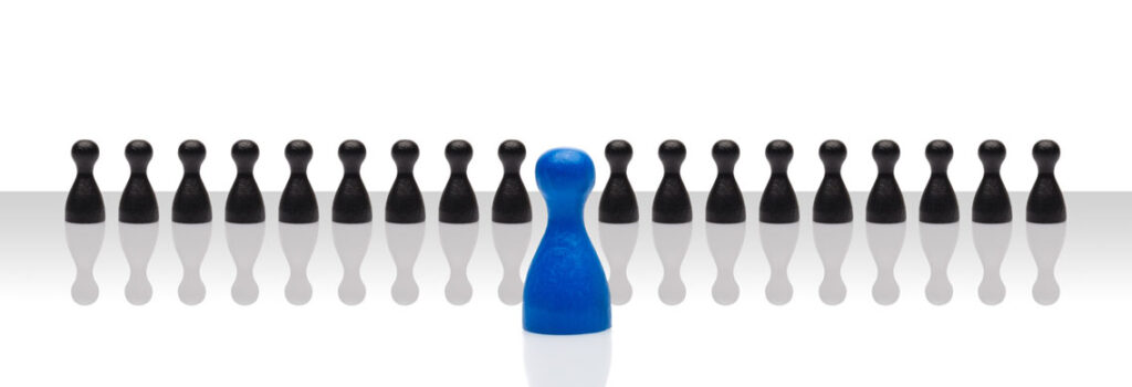 black chess like pieces with one blue piece in the middle 303 Networks